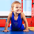 Young girl smiles after her gym lessons at SWIMkids USA