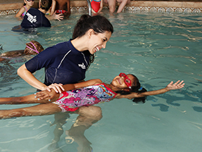 Child swimming lessons taking place with our swim instructor