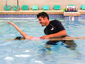 Teaching swim lessons in our indoor heated pool for kids swim lessons